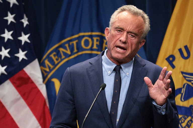Robert F. Kennedy Jr. gestures while speaking at a podium