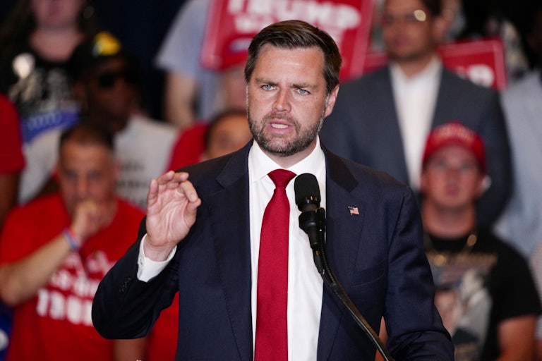 J.D. Vance gestures while speaking at a Donald Trump rally