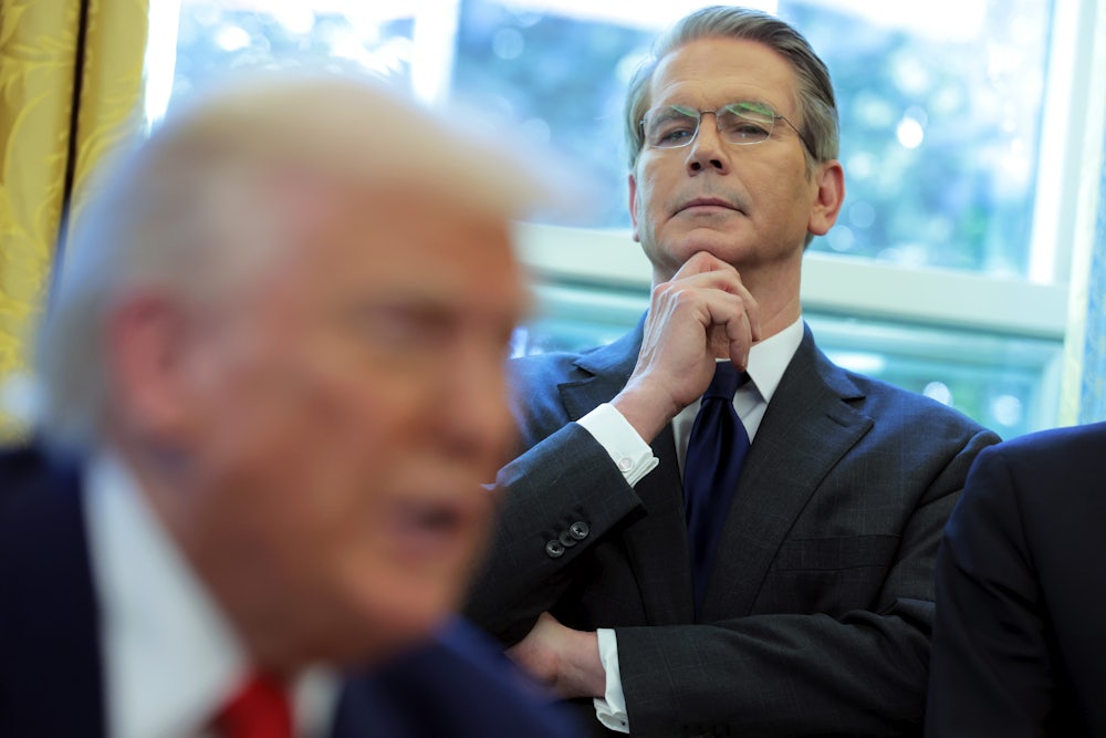 Treasury Secretary Scott Bessent looks on as Trump signs executive orders in the Oval Office