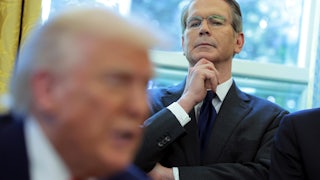 Treasury Secretary Scott Bessent looks on as Trump signs executive orders in the Oval Office