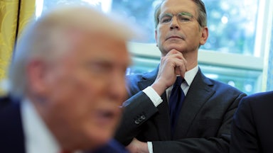 Treasury Secretary Scott Bessent looks on as Trump signs executive orders in the Oval Office