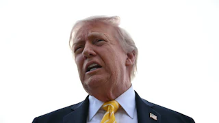 Donald Trump speaks to reporters