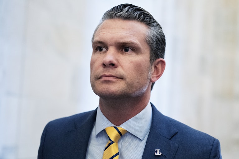 Pete Hegseth walks in the Senate