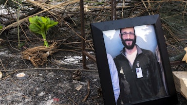 framed photo of Alex Pretti on the ground