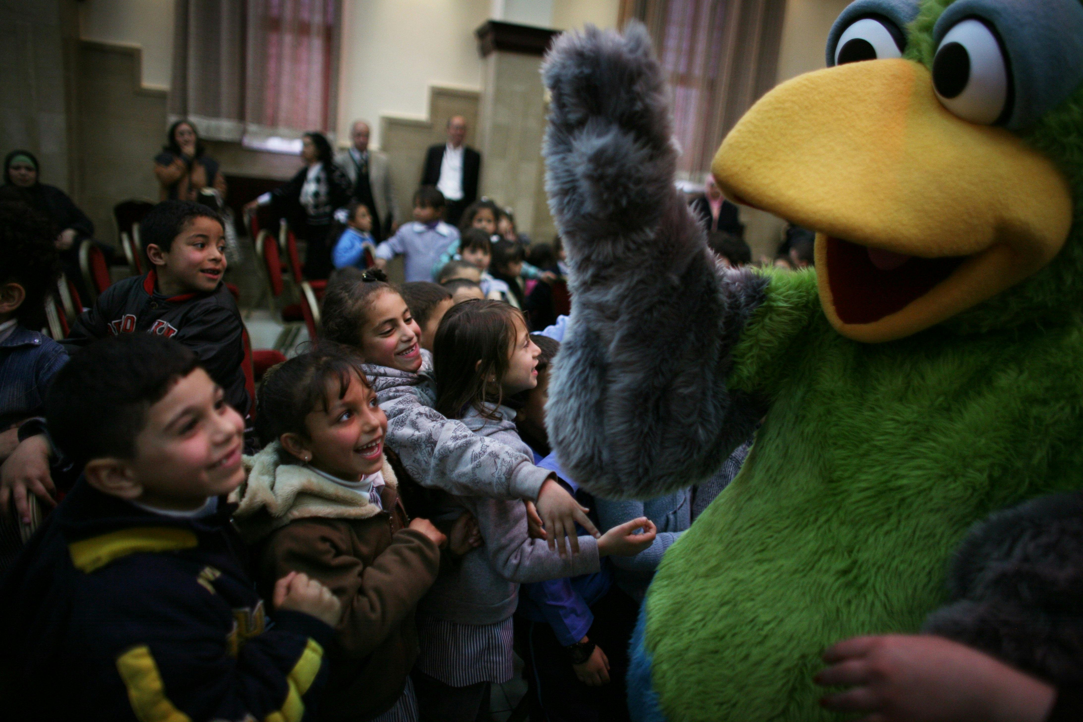 “Sesame Street” character Kareem waves to Palestinian children during a 2009 performance 