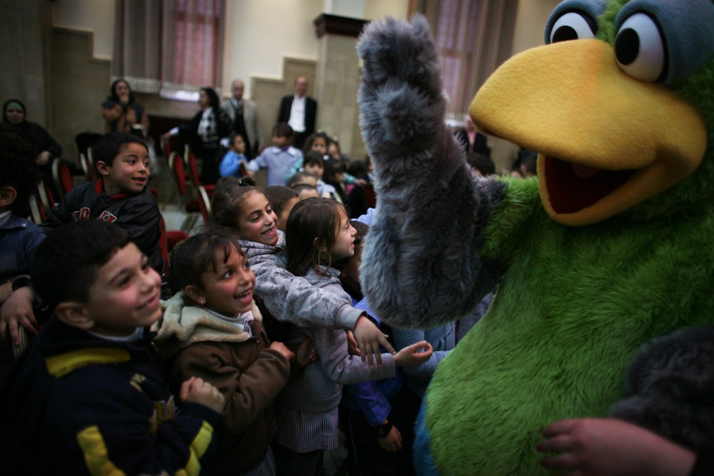 “Sesame Street” character Kareem waves to Palestinian children during a 2009 performance
