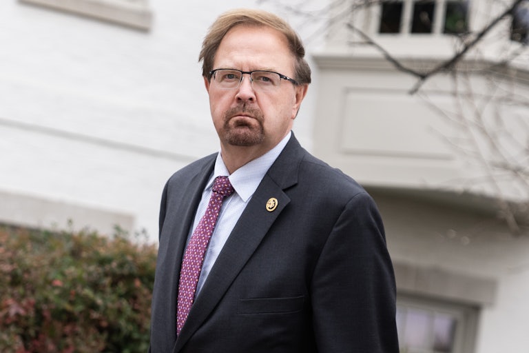 Representative Chuck Edwards stares (maybe frowning) at the camera