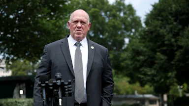 Trump border czar Tom Homan stands by a mic outside the White House.