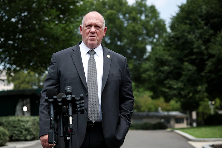 Trump's border czar, Tom Homan, stands by a microphone outside the White House.