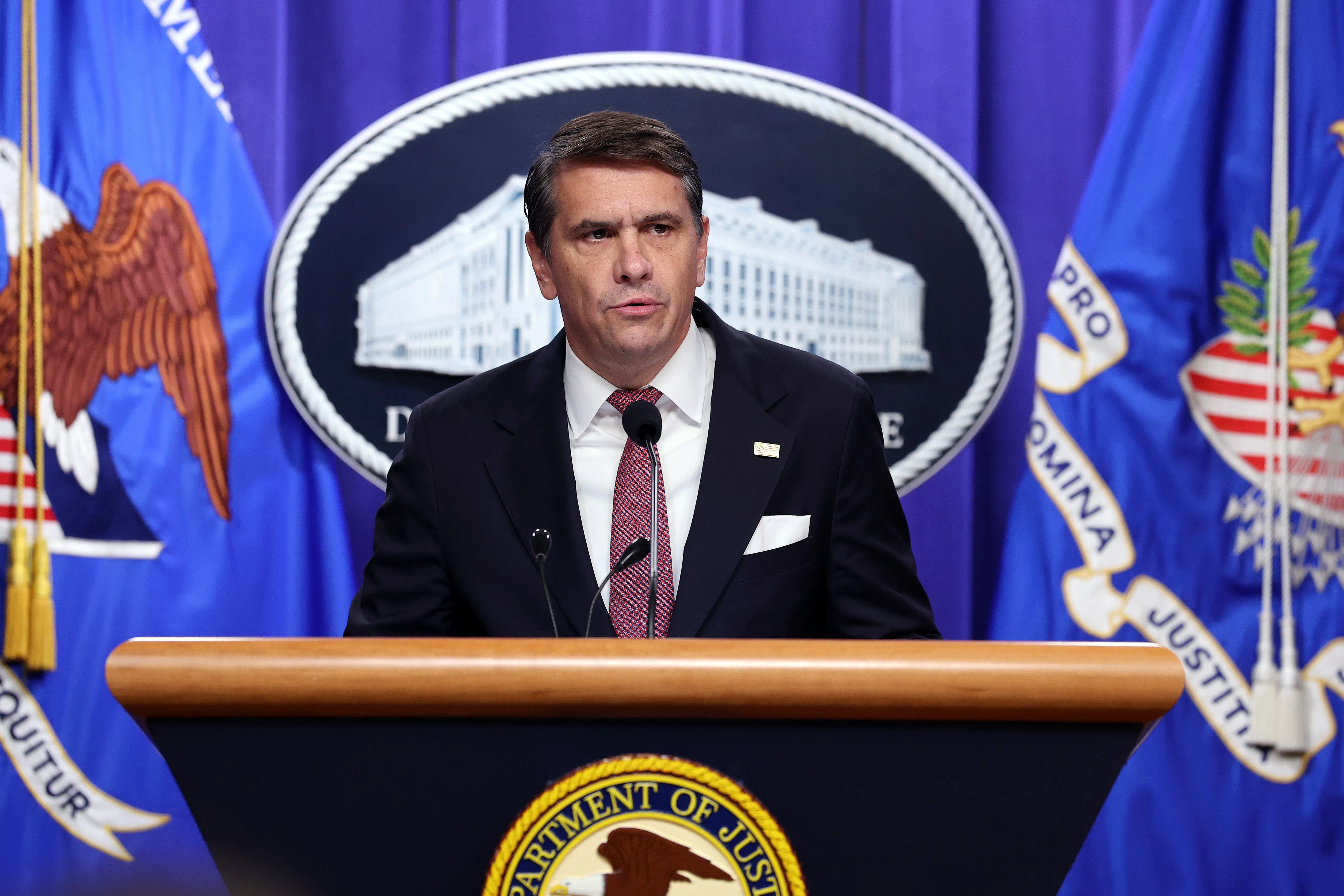 Acting Attorney General Todd Blanche speaks at a podium