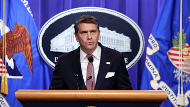Acting Attorney General Todd Blanche speaks at a podium