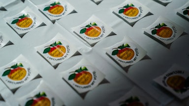 “I secured my vote” stickers on a table at a polling station in Georgia