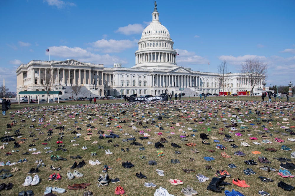 The lawn outside the US Capitol is covered with pairs of empty shoes to memorialize the children killed by gun violence since the Sandy Hook school shooting.