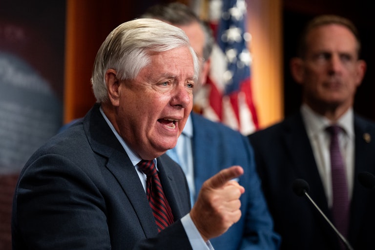 Lindsey Graham gestures as he speaks