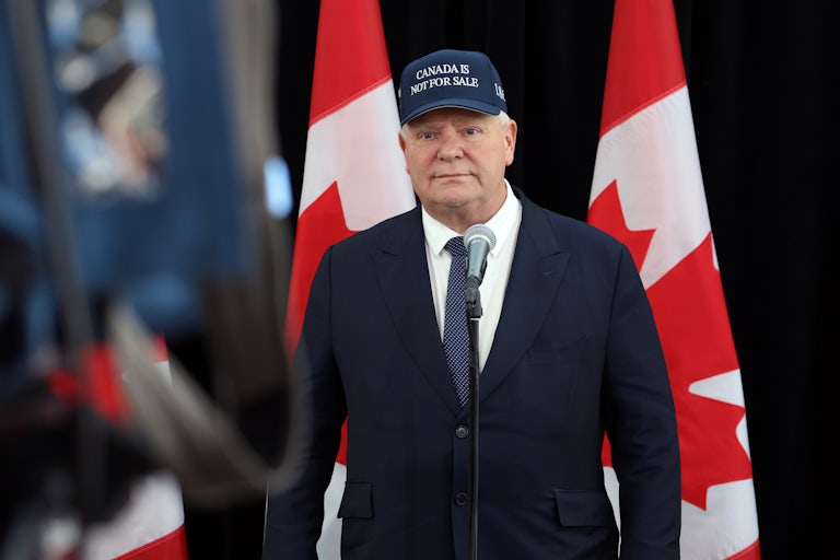 Ontario Premier Doug Ford wears a cap that says "Canada Is Not For Sale."