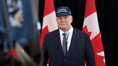 Ontario Premier Doug Ford wears a cap that says "Canada Is Not For Sale."