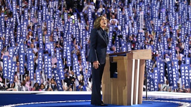 Kamala Harris reacts with an awestruck look as she arrives on stage speak on the fourth and final day of the Democratic National Convention amid a crowd of delegates holding signs reading "Kamala."