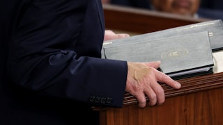 A giant blob of concealer (not the right shade) on Donald Trump's right hand.