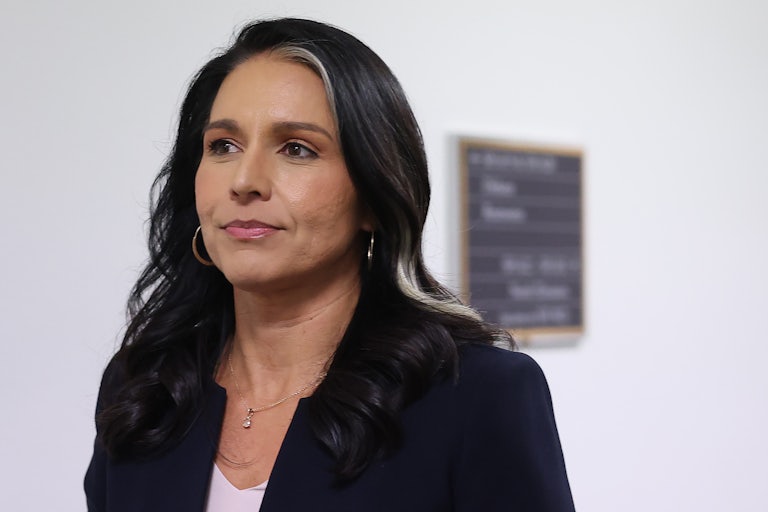 Tulsi Gabbard walks in a Senate building