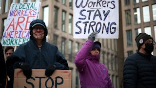 Federal workers rally outside of the U.S. Office of Personnel Management in protest of the Trump administrations war on the civil service.