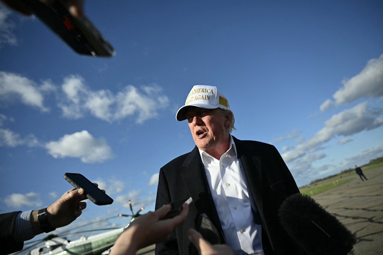 Donald Trump speaks to reporters before boarding Air Force One