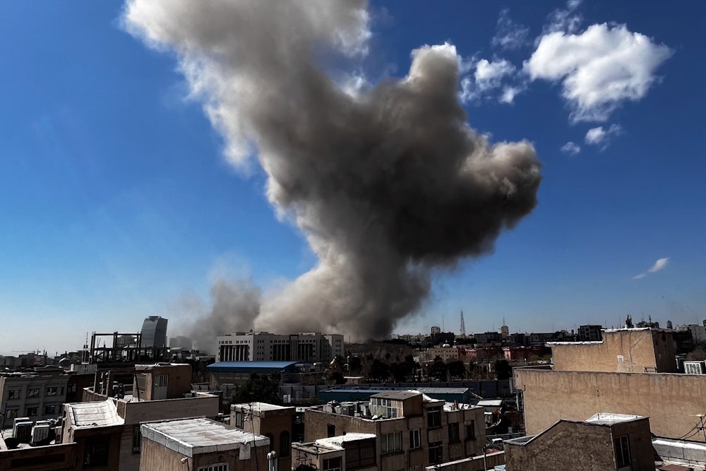 Plumes of smoke rise following explosions in Tehran