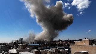Plumes of smoke rise following explosions in Tehran