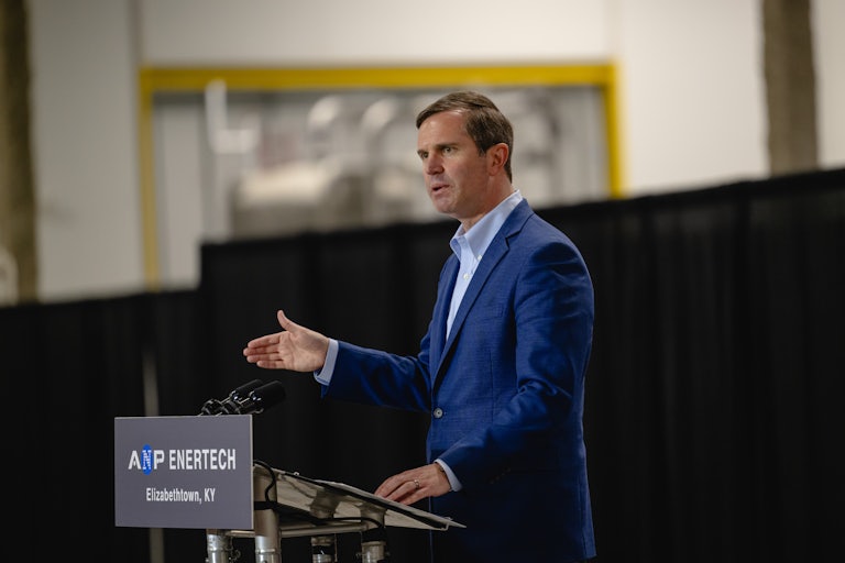 Kentucky Governor Andy Beshear speaks at a podium