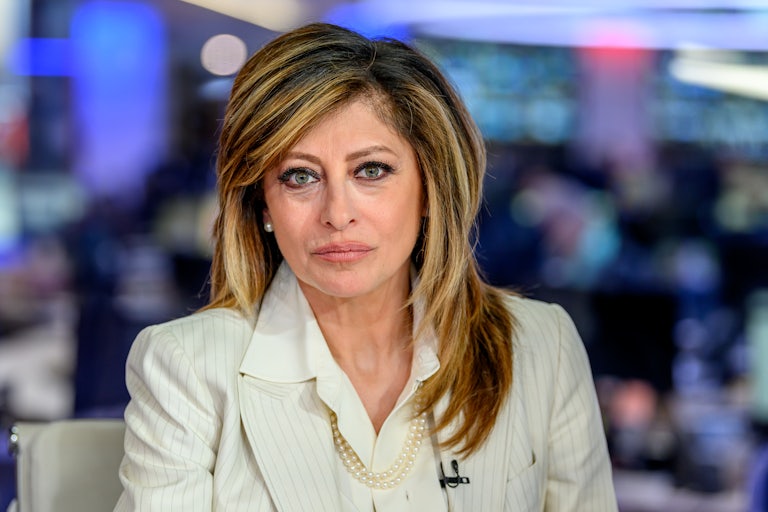 Fox News host Maria Bartiromo stares directly at the camera while on set