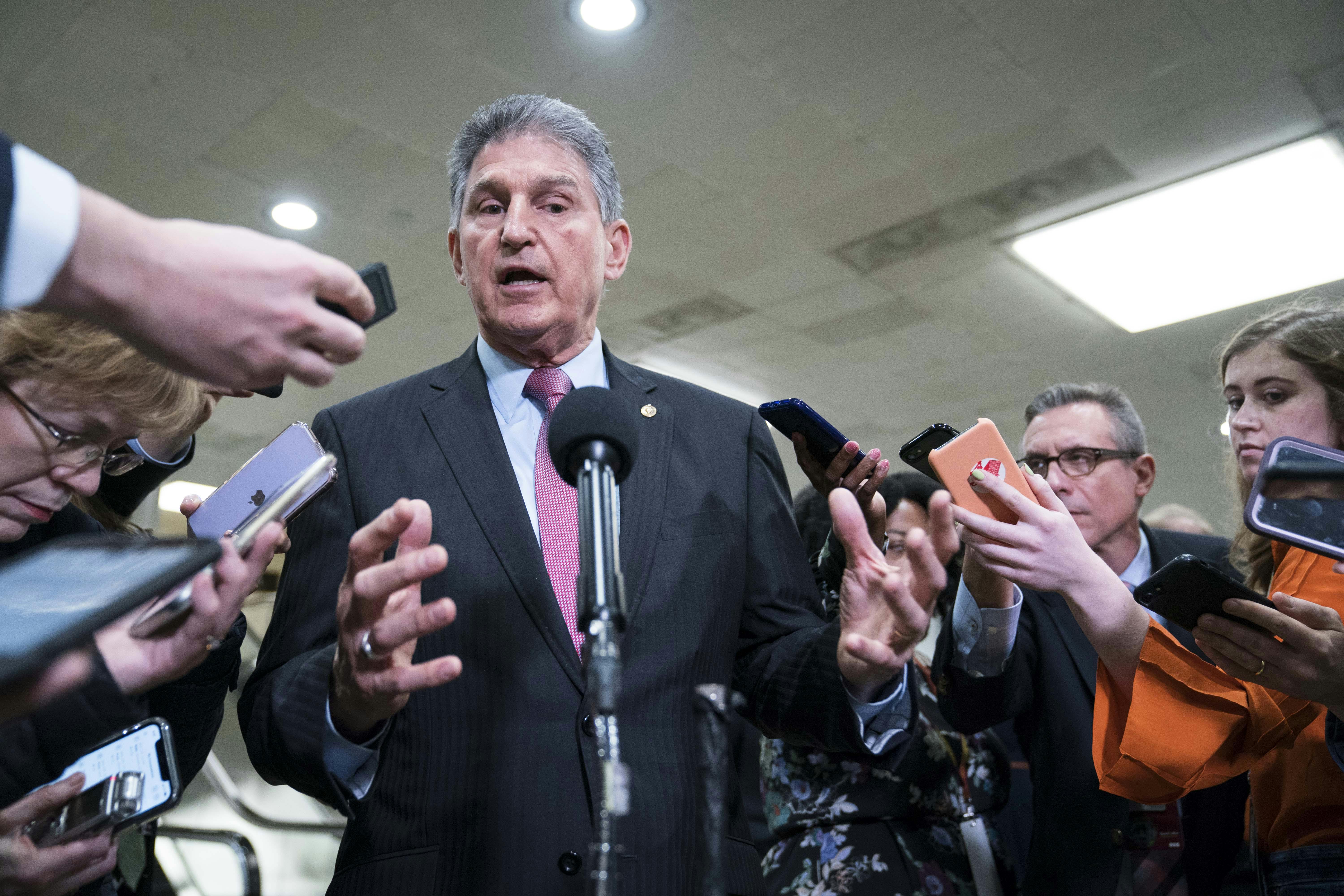 West Virginia Senator Joe Manchin speaks to reporters at the U.S. Capitol