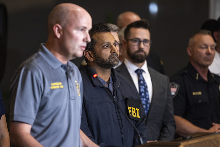 FBI Director Kash Patel stands during a press conference after Charlie Kirk's shooting
