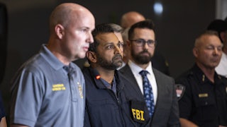 FBI Director Kash Patel stands during a press conference after Charlie Kirk's shooting