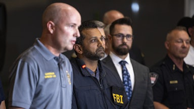 FBI Director Kash Patel stands during a press conference after Charlie Kirk's shooting