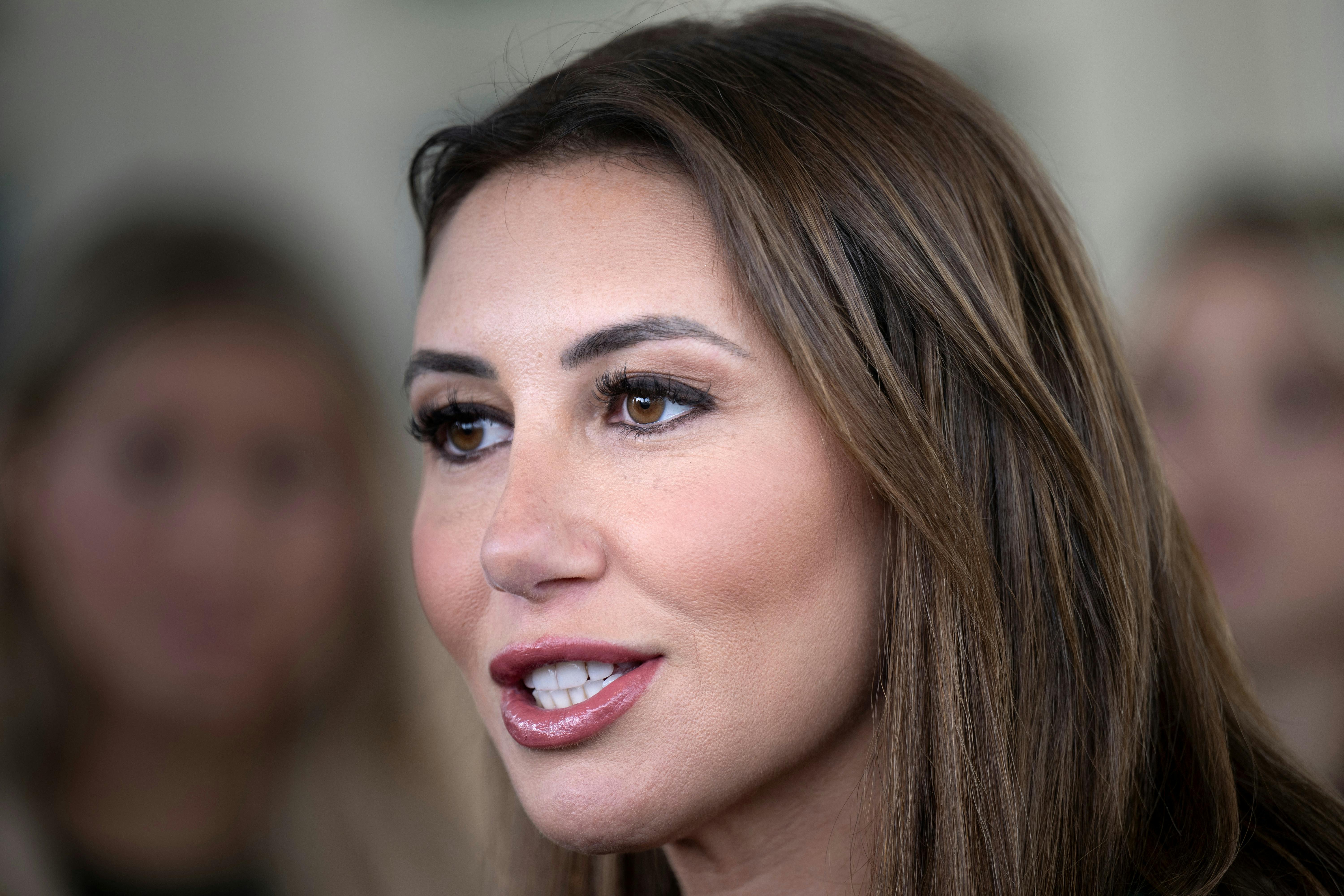 Alina Habba speaks to reporters outside the White House