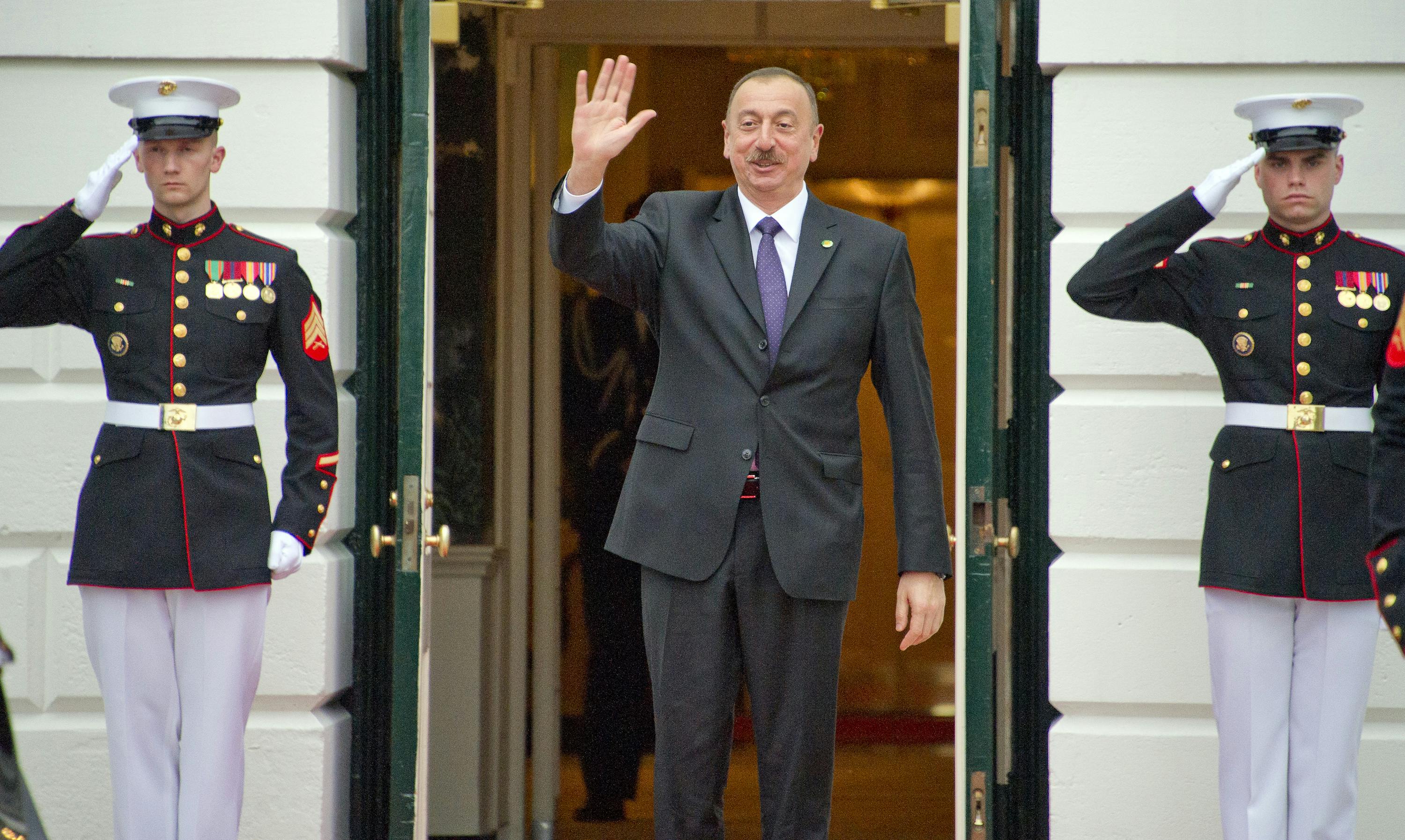 Azeri president Ilham Aliyev waves as he exits the White House in 2016.