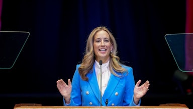 New Jersey Governor Mikie Sherill gestures with both hands while speaking at a podium