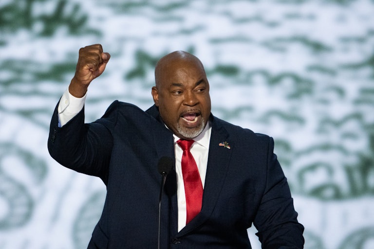 Mark Robinson speaks and raises his fist at the Republican National Convention