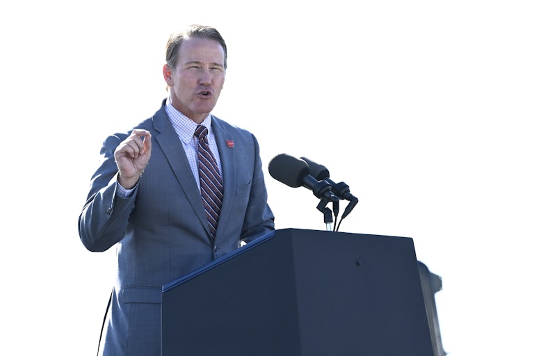 Ohio Lieutenant Governor Jon Husted gestures while speaking at a podium