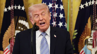 Donald Trump speaks at a podium during a White House event