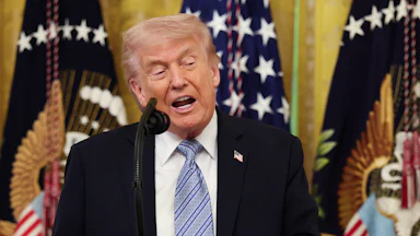 Donald Trump speaks at a podium during a White House event
