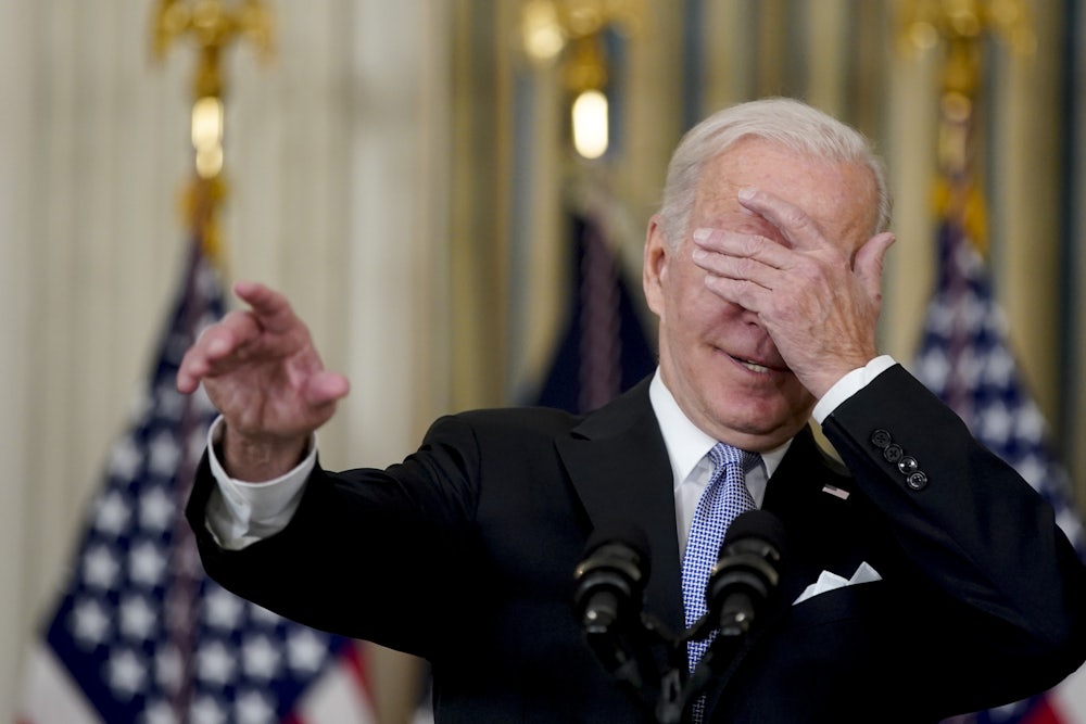 Biden covers his eyes