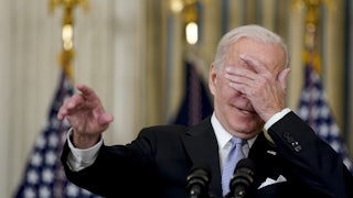 Biden covers his eyes
