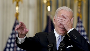 Biden covers his eyes