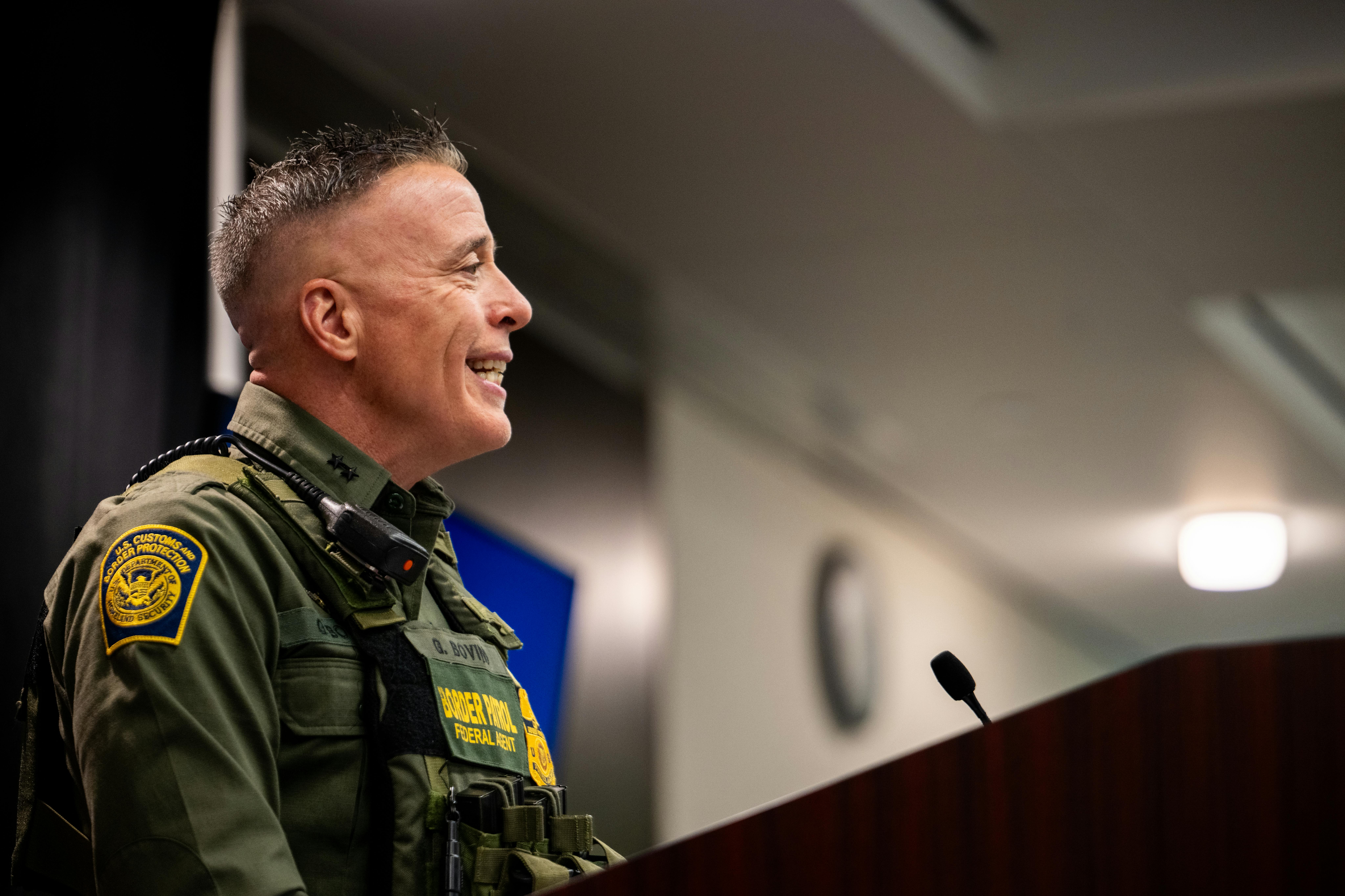 Customs and Border Protection commander Gregory Bovino smiles while speaking during a press conference