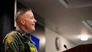 Customs and Border Protection commander Gregory Bovino smiles while speaking during a press conference