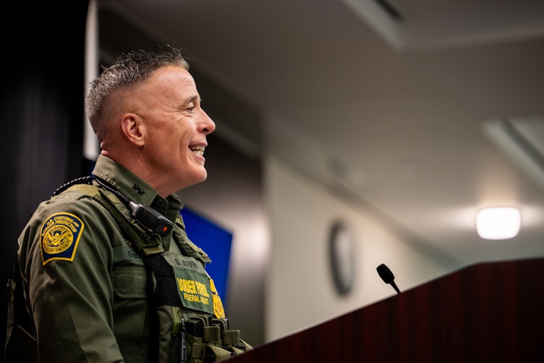 Customs and Border Protection commander Gregory Bovino smiles while speaking during a press conference