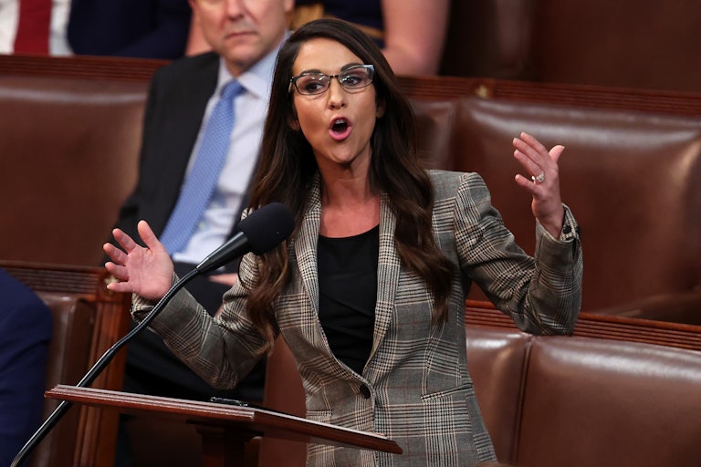 Lauren Boebert speaks on the House floor and makes hand gestures