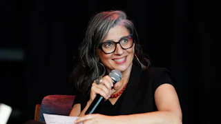 Francesca Albanese, United Nations Special Rapporteur on the occupied Palestinian territories, speaks into a microphone