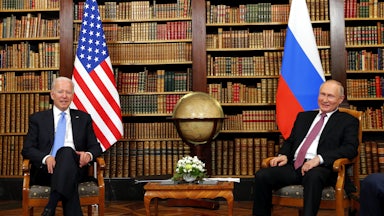 President Joe Biden and Russia's President Vladimir Putin sit across from each other at a summit in Geneva, Switzerland.