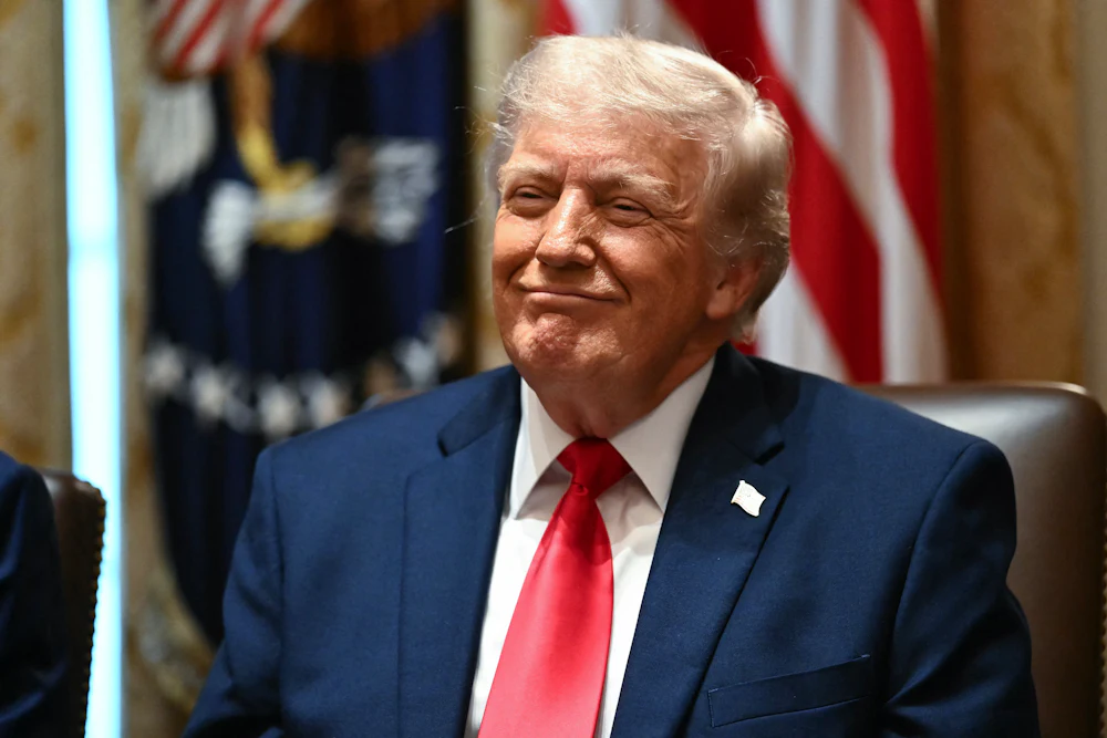 Donald Trump smirks during a cabinet meeting in Washington, D.C., on May 27